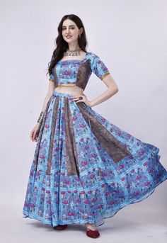 Step into the enchanting world of Navratri with our exquisite Blue and Grey Chaniya Choli set. This stunning ensemble is meticulously crafted to make your celebrations truly special. 🌟 Choli: Our Choli is made from luxurious Blue hammered satin, featuring an alluring open back design secured with delicate dori ties, ensuring a perfect fit. 🌸 Chaniya: The Chaniya boasts the same Hammered Satin Blue and Printed Grey Muslin fabric, harmoniously blended to create a visual masterpiece that reflects the spirit of Navratri. 🧣 Graceful Dupatta: Adorned with a Grey printed pure Chiffon dupatta, this set exudes grace and sophistication, completing your Navratri look with finesse. 🪔 Unforgettable Navratri: Elevate your Navratri celebrations with this exceptional Chaniya Choli set, designed to mak Bohemian Lehenga With Pallu For Navratri, Bohemian Semi-stitched Choli For Navratri, Semi-stitched Bohemian Choli For Navratri, Bollywood Style Pre-draped Saree With Tilla For Navratri, Bohemian Sets With Pallu For Navratri, Grey Chaniya Choli, Bohemian Art Silk Sets For Navratri, Bohemian Lehenga For Reception, Bohemian Blue Floor-length Lehenga