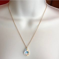 Nwot. Beautiful Irredescent Crystal Pendant Necklace, Which Comes On A Gold Chain. The Crystal Pendant Is Radiant And Displays A Rainbow Of Colors! The Chain Is Gold And Measures 18" In Length With An Additional 3.5" Of Adjustable Links. Comes With A Lobster Clasp.