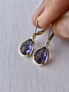 Amethyst Earrings, February Birthstone, Purple Teardrop Gem Earrings in Gold or Silver, Purple Jewelry, Lavender Earrings, Gift for women These small but gorgeous earrings feature deep purple amethyst teardrops bezel framed in either 14k gold filled or sterling silver. The teardrops are suspended form lever back ear wires in the finish of your choice. These are small, delicate and dainty earrings but with a gorgeous lavender color sure to match many outfits. Ideal for a girl or a women that like Elegant Amethyst Teardrop Dangle Earrings, Purple Gemstone Teardrop Earrings, Elegant Lavender Earrings With Ear Wire, Elegant Purple Teardrop Crystal Earrings, Lavender Drop Earrings For Formal Occasions, Lavender Dangle Earrings For Formal Occasion, Elegant Lavender Drop Earrings, Purple Teardrop Gemstone Earrings, Lavender Teardrop Earrings With Ear Wire