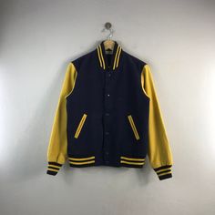 "PLEASE READ DESCRIPTION BELOW BEFORE BUYING👇🏻 *ITEM:Vintage King Guard Versity Jacket *ITEM DETAILS: 👇🏻 Please be aware that all vintage items will usually show a few signs of wear or fading due to age, but anything visible such as stains or holes, and serious flaws have been photographed.For any further information on this item please contact us and we will be happy to help. *SIZE:MEDIUM *ACTUAL SIZE MEASUREMENT: 👇🏻 *PIT TO PIT(WIDTH):20\"INCHES *LENGTH(FROM SHOULDER): 25\"INCHES 16&24 * Winter Outdoor Varsity Jacket With Patchwork, Urban Style Blue Varsity Jacket For Sports, Urban Blue Varsity Jacket For Sports, Blue Cotton Varsity Jacket For Streetwear, Cotton Varsity Jacket With Baseball Collar For Outdoor, Sporty Blue Varsity Jacket For Streetwear, Winter Varsity Jacket With Contrast Color, Winter Cotton Varsity Jacket With Contrast Color, Urban Style Blue Varsity Jacket For Fall