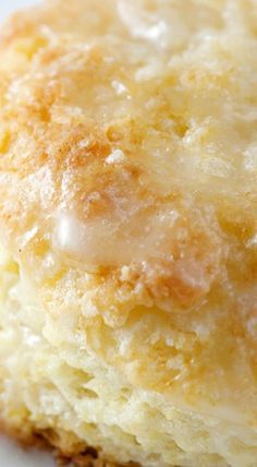 a close up of a piece of food on a white plate with some icing