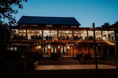 a large building with lots of lights around it