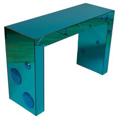 a glass desk with blue circles and holes on the top, against a white background