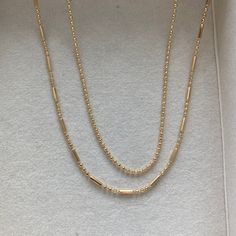 Simple and elegant in design, this gold filled necklace is a perfect addition for someone looking for a dainty gold necklace to add to their daily rotation. Pair with a pendant, beaded necklace, or STACK with the essential stack. 14k Gold Filled Necklaces With Delicate Chain For Layering, 14k Gold Filled Delicate Chain Necklaces For Layering, Dainty Beaded Chain Necklaces For Layering, Minimalist 14k Gold Filled Round Bead Necklaces, Dainty Beaded Chain Necklace For Layering, Everyday 14k Gold-filled Necklaces With Gold Beads, Everyday 14k Gold Filled Beaded Chain Necklace, Rose Gold Satellite Chain Necklace For Everyday, Dainty Layered 14k Gold Filled Necklace With Adjustable Chain