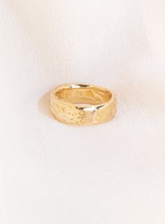 Hand-carved texturized band available in solid 14k Yellow, White, or Rose Gold. Approx. 6mm wide and 7.5g. This luminous double-wide Divinité band embodies the strength of effervescent, exuberant Love. Love is Sacred and Divine - it is the miraculous gift of the Holy Spirit, making up the world we live in. A reminder to keep love at the forefront of all you do, a token of celebration, steadfastness and joy, a talisman of your angels guiding you through unconditional self-love and the ability to 14k Gold Thick Band For Promise, Thick Band 14k Gold Promise Ring, Yellow Gold Thick Band Jewelry For Promise, Yellow Gold Promise Jewelry With Thick Band, Yellow Gold Thick Band Promise Jewelry, Thick Band Engraved Promise Ring, 14k Gold Hammered Bands, 14k Gold Thick Band With Diamond Cut, Textured 14k Yellow Gold Jewelry