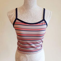 "Sweet vintage Champion sports crop top. Colorful stripes,blue suspenders and a edge around the sleeve. It has a logo printed at the end. Fabric is stretchy. It is padded on the chest,see last image. In excellent vintage condition. Tag size: US M,but smaller,best fits to size US XS/S,check the measures. Materials: polyester 88%,spandex 12% Label: Champion  Measures taken flat,one side bust 36.5 - 48 cm = 14,37 - 18,90\" waist 34 - 37 cm = 13,38 - 14,57\" length with suspenders about 43 cm = 16,9 Fitted Blue Top With Contrast Stripes, Summer Sports Tops With Contrast Stripes, Summer Sports Top With Contrast Stripes, Striped Fitted Tank Top With Tank Straps, Striped Fitted Crop Top Tank, Fitted Striped Crop Top Tank, Fitted Tank Top With Contrast Stripes For Spring, Sporty Cropped Tops With Adjustable Straps, Fitted Striped Tank Top