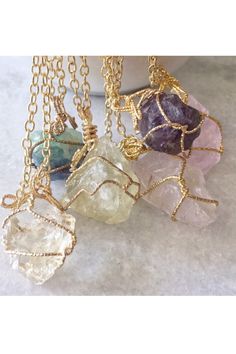 A great necklace to grab and go! Beautiful natural colors and translucent glow! Each Stone is unique in cut and color. Wrapped in Gold Wire. Available in: Amber Green Yellow Purple Pink White Gift Natural Stones Clear Necklace, Yellow Wire Wrapped Necklace As Gift, Yellow Wire Wrapped Necklace For Gift, Clear Wire Wrapped Necklace As Gift, Clear Pendant Necklace For Healing, Wrapped Necklace, Wire Wrapped Necklace, Yellow Purple, Gold Wire