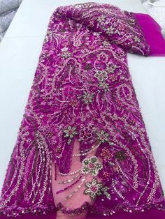 This high quality Fabric is measured in 5 Yards With Embroidered Beading and Sequin. It is soft, very delicate and beautiful. This high Quality Fabric is made with Fashion embroidered rhinestones can be used in making party wedding dresses, skirts, shawls, scarves and other other fashion apparels as you would like. Size : Length : 5 yards (180 inch). Width: 50 inch (Please allow slight deviation for the measurement data ,±1 inch) Material: 100% Polyester, Tulle Lace Fabric, Eco-Friendly embroide Pink Beaded Embroidered Fabric For Party, Pink Embellished Embroidered Fabric For Evening, Pink Beaded Lace Embroidered Fabric, Pink Lace Fabric With Rhinestones Embroidery, Elegant Pink Sequin Fabric For Celebration, Pink Rhinestone-embroidered Lace Fabric, Pink Embroidered Fabric With Rhinestones For Wedding, Pink Beaded Lace Fabric, Nigerian Beads