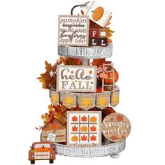 a tiered display with pumpkins, leaves and other items on it's sides