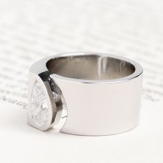 a close up of a ring on top of a piece of paper