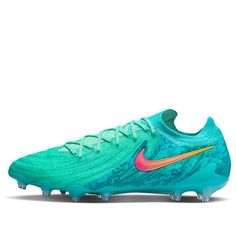 the nike vapor soccer shoe in blue and pink is shown on a white background with an orange