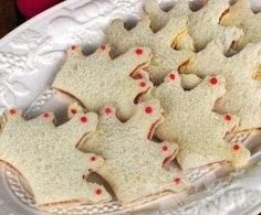 some cookies are on a white plate and ready to be cut into pieces or put in the oven