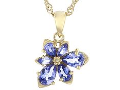 0.99ctw pear shape and .12ctw marquise tanzanite 18k yellow gold over sterling silver asymmetrical flower pendant with 18" Singapore chain. Measures approximately .73"L x .53"W. 3.1mm bail. Lobster claw clasp with a 2" extender. Yellow Gold Teardrop Fine Jewelry, Formal Yellow Gold Flower-shaped Jewelry, Exquisite Gemstone Flower Pendant Jewelry, Formal Yellow Gold Tanzanite Jewelry, Formal Yellow Gold Flower Pendant Jewelry, Teardrop Tanzanite Jewelry In Yellow Gold, Teardrop Tanzanite Gemstone Jewelry, Tanzanite Teardrop Gemstone Jewelry, Fine Jewelry Tanzanite Necklace