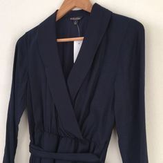 Brooks Brothers Faux Wrap Navy Silk/Wool Dress Size 4 New With Tags - Excellent Condition. V-Neck With Beautiful Collar; Faux Wrap Elastic Waist With Sash; Side Zipper; Long Sleeve With Buttons; And Navy Blue Color Dress. Chic V-neck Midi Dress For Business, Fall Office Dress With Surplice Neckline, Spring V-neck Dress For Office, Office Dress With Surplice Neckline For Fall, V-neck Viscose Dress For Work, Blue Midi Dress For Workwear In Fall, Viscose V-neck Dress For Work, Blue Fall Dress For Workwear, Blue Fall Dress For Work