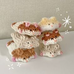 three small crocheted animals sitting next to each other