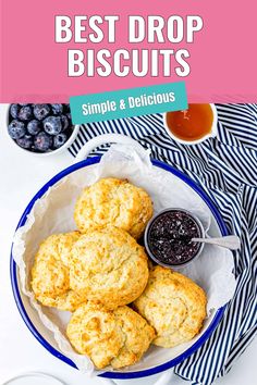 biscuits and blueberries on a white plate with text overlay that reads best drop biscuits simple & delicious