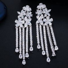 Brand New High Quality Zirconia Long Flower Tassel Earrings. I Have Only Silver Available. * Main Stone: Zircon * Metal: 925, Sterling * Earring Size: 6 Cm * Stone Quality Aaa * Quality: Gorgeous, Fashion, Luxury Please Comment For Any Questions :) Formal Dangle Flower Earrings With Cubic Zirconia, White Dangle Chandelier Earrings With Cubic Zirconia, Elegant Silver Crystal Flower Earrings, White Cubic Zirconia Chandelier Earrings Gift, Formal Bridal Earrings With Cubic Zirconia In Flower Shape, White Cubic Zirconia Dangle Bridal Earrings, Flower-shaped Cubic Zirconia Bridal Earrings For Pierced Ears, Cubic Zirconia Flower Bridal Earrings, Flower Shaped Cubic Zirconia Earrings With Sparkling Stones