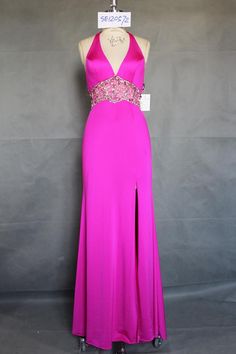 A fuchsia evening dresses with a halter neckline and beaded empire waist.