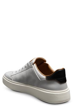 A shock-absorbing FlyForm insole keeps you comfy in this slip-on sneaker made from smooth leather with ventilating perforated side panels and elasticized laces. Pull-on style with elastic laces Memory foam cushioning Leather upper and lining/rubber sole Imported White Leather Slip-on Sneakers For Sports, Low-top Sneakers With Vented Sides And White Sole, Sporty Leather Slip-on Sneakers With Perforations, White Low-top Slip-on Sneakers With Perforations, Low-top Perforated Slip-on Sneakers For Sports, Synthetic Low-top Sneakers With Vented Sides, Slip-on Streetwear Sneakers With Perforations, Custom Low-top Synthetic Sneakers With Perforations, Sporty Slip-on Sneakers With Perforations