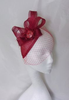 This 'Cherry Red Beatrix' fascinator mini hat made to order only, please allow up to 5-7 days for making plus shipping. In some instances, the turnaround of the order may be quicker. This is a beautiful and elegant lightweight cocktail fascinator hat in shades of red. It is a bespoke one off piece.   Made with a dark red teardrop sinamay disc, which has either a clear plastic comb hand stitched underneath facing backwards or forwards, to make it more versatile and able to be worn in many positio Teardrop Fascinator Hats, Vintage Wedding Hats, Dark Cherry Red, Tartan Hat, Red Veil, Ascot Races, Red Fascinator, Feather Headpiece, Diva Design