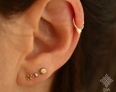 14K SOLID GOLD star SINGLE stud earring Perfect for a variety of piercing locations: nostril / lobe / 3rd, 2nd hole earring / tragus / conch / helix / cartilage ---> Features: ♦ Material: 14k SOLID GOLD ♦ Size: ♦ GAUGE - wire thickness : 20 gauge = 0.8 mm Please convo me for a different gauge size. ♦ Select your preference in shape at the top right of this page. L shape (6*5.5 mm) / Right screw shape / Left screw shape / Bone end (8mm approx.) / Straight end post with silicone back (10mm appr Gold Star Cartilage Earrings For Pierced Ears, Gold Star Cartilage Earrings, Gold Star Shaped Pierced Cartilage Earrings, Tiny Gold Star Cartilage Earrings, Star Nose Stud, Stud Nose Piercing, Tiny Nose Studs, Tiny Nose, Tiny Gold Studs