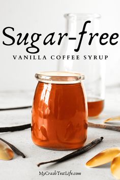 sugar - free vanilla coffee syrup in a glass jar with spoons on the side