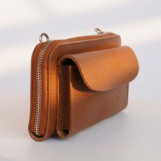 This elegant, genuine Italian leather wallet comes with straps and is the perfect everyday purse. It holds all of your essentials, is cute, and goes with phone pocket. DETAILS:  .: Genuine leather wallet bag  .: Strap included   .: Made in Italy  .: Hand made  .: Strap is adjustable from 23 to 45 inches.  Dimensions 8x4 inch , it's enough space for money, cards, mobile phone. SHIPPING .: Once your order is placed, you can expect your package will be shipped within 1-3 business days  .: Our store is located in Texas, and all items are shipped out of Texas CARE: .: To keep your wallet lasting longer treat it like your skin.) You can wash it, but do not overdry with soap.  Do not machine wash or tumble dry. Anyway natural skin is always strong and durable. MORE: Return: You can make a return Versatile Brown Wallet With Mobile Phone Bag, Versatile Brown Wallet With Removable Pouch, Versatile Brown Phone Bag With Card Slots, Versatile Brown Phone Bag With Interior Card Slots, Everyday Leather Wallet With Mobile Phone Bag, Classic Wallets With Adjustable Strap For Daily Use, Brown Wallets With Mobile Phone Bag For Everyday, Brown Wallets With Mobile Phone Bag, Brown Shoulder Bag With Card Slots For Everyday