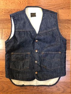 * GREAT CONDITION * small ink stain on inside lining  << MEASUREMENTS >>        CHEST = 19''         LENGTH = 24''  < measurements are taken lying flat  -- POLICIES --  Shipping takes 1-3 days after purchase to process, all sales are final and no refunds.  ~ happy to answer any questions Classic Cotton Denim Vest With Pockets, Classic Denim Blue Cotton Denim Vest, Classic Denim Blue Cotton Vest, Classic Cotton Denim Vest In Medium Wash, Classic Denim Blue Vest With Pockets, Denim Vest Men, 1970s Men, Womens Denim Vest, Vintage Denim Vest