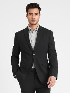 You asked for it, our designers delivered.  This is a sharply tailored suit in a slimmer-than-slim fit, made with lightweight, stretch wool from Italian mill Marzotto.  Plus, our designers added a special pocket at the hip big enough to fit a phone or even a flask—we won't tell… Fully lined with stretch lining for extra comfort.  Underarm shields reduce the need for dry cleaning.  Under-collar melton helps keep shape and adds style when the collar is turned up.  Notch lapel.  Two-button closure. Modern Fitted Sport Coat With Suit Collar, Slim Fit Single Button Tuxedo For Business Casual, Fitted Sport Coat With Suit Collar For Business Casual, Fitted Sport Coat For Office With Welt Pockets, Fitted Sport Coat With Welt Pockets For Office, Modern Fitted Blazer For Office Wear, Modern Fitted Sport Coat For Semi-formal Occasions, Fitted Office Wear Blazer In Suiting Fabric, Modern Fitted Semi-formal Sport Coat