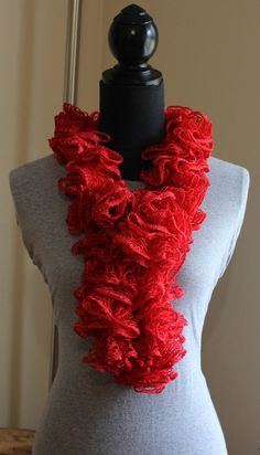 a mannequin with a red scarf on it