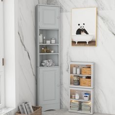 a bathroom with marble walls and flooring, including a white cabinet next to the bathtub