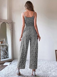 This printed, stylish Ditsy Floral Tie Front Shirred Waist Cami Jumpsuit is perfect for any occasion. The high waist and regular fit provide a flattering silhouette that's both comfortable and stylish. Crafted from a non-stretch fabric, this top is made of 100% polyester, making it lightweight and breathable. The spaghetti straps make it easy to adjust the fit, and the sleeveless design is perfect for summer days. Elevate any look with this versatile top. Specifications: Details: Shirred, Tie Front Neckline: Spaghetti Strap Sleeve Length: Sleeveless Waist Line: High Waist Fit Type: Regular Fit Fabric: Non-Stretch Material: Fabric Composition: 100% Polyester Care Instructions: Machine wash or professional dry clean Product Measurements(cm): Size US Bust Hip Size Length Thigh Waist Size XS 2 Casual Floral Print V-neck Jumpsuits And Rompers, Casual Printed Patterned Jumpsuits And Rompers, Casual Patterned Jumpsuits And Rompers For Vacation, Sleeveless Floral Print Jumpsuits, Casual Patterned Jumpsuits And Rompers For Spring, Sleeveless Non-stretch Floral Jumpsuits And Rompers, Casual Printed V-neck Jumpsuits And Rompers, Trendy V-neck Jumpsuits And Rompers With Floral Print, Chic Cotton Floral Print Jumpsuits And Rompers