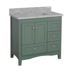 a green bathroom vanity with marble top and drawers