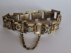 "Measures Approx. 7 1/2\" long x 5/8\" wide Previously Owned Condition. Does have wear to finish on the back of bracelet. NOTE: This style the safety clasp did not come apart, it is connected to the bracelet on both ends. See photos. My items are previously owned or vintage items. As with most previously owned items they may have light surface scratches or very light wear. PLEASE NOTE: Due to the exorbitant fees attached to selling online, any sale item purchased through Etsy Marketing program maybe canceled and refunded. If you are unfamiliar with Etsy Marketing please read Etsy's site.  Sorry for any inconvenience this may cause." Adjustable Formal Chain Bracelet With Clasp, Adjustable Chain Bracelet With Clasp For Formal Occasions, Rectangular Metal Bracelet With Box Clasp, Metal Chain Bracelet With Clasp For Formal Occasions, Adjustable Link Chain Bracelet With Clasp, Formal Metal Chain Bracelet With Clasp, Vintage Chain Link Metal Bracelets, Vintage Metal Bracelets With Chain Link, Vintage Adjustable Charm Bracelet For Formal Occasions