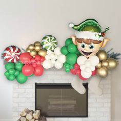 a fireplace decorated with christmas decorations and balloons