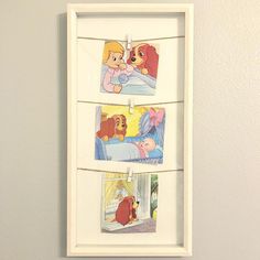 three pictures hanging on the wall with clothes pins attached to them, in front of a white frame