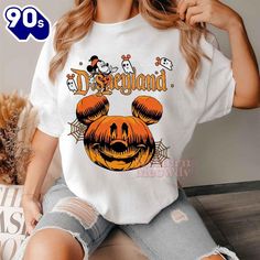 Disneyland Mickey Mouse Halloween Shirt This versatile T-shirt is perfect for everyone, combining style and comfort. Made from soft, high-quality fabric, it features a classic fit that suits any body type. Ideal for casual wear or layering, this T-shirt comes in a variety of colors to match any wardrobe. Its durable construction ensures long-lasting wear, making it a staple piece for both men and women Photos Of Disneyland Mickey Mouse Halloween Shirt Product details: Disneyland Mickey Mouse Hal White Character Print T-shirt For Fall, White T-shirt With Character Print For Fall, Disneyland Mickey Mouse, Mouse Halloween, One Piece Cartoon, Disneyland Halloween, Mickey Mouse Halloween, Mickey Mouse Cartoon, Fashion Essentials