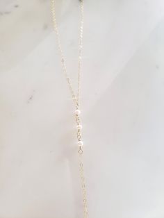 "These dainty and thoughtfully designed necklaces are stunning paired as a set or on their own! Would be wonderful for a bride or as a feminine and lovely touch to your every day. Genuine freshwater pearls are wire wrapped in a minimal/vintage-y/boho style. Made from top quality materials- true 14k gold fill or solid sterling silver, will not tarnish or turn you green, wear 24/7! Secured with an easy to use oval lobster clasp. Lead and nickel free. Excellent for sensitive skin! Come packaged in Wedding Necklace With Clavicle Chain, Wedding Necklaces With Clavicle Chain, Wedding Long Necklace With Clavicle Chain, Wedding Charm Necklace With Delicate 14k Gold Filled Chain, Elegant Adjustable Layered Necklace, Long Clavicle Chain Necklace For Wedding, Wedding Clavicle Chain Long Necklace, Wedding Long Clavicle Necklace, Dainty Long Chain Necklace For Wedding