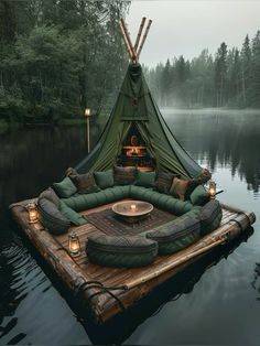 a tent sitting on top of a raft in the water