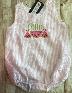 Super cute Personalized name baby toddler pinstriped seersucker bubble romper is embroidered with watermelons and name  The bubble romper  is pinstriped seersucker cotton and it  has buttons on shoulders and snap closure  The font is Simple  The design is embroidered with pink  , Lime green and black  Machine washer cold water and dryer safe on low tumble Bubble Clothes, Watermelon Summer, Toddler Summer, Summer Watermelon, Pink Bubbles, Bubble Romper, Girls Toddler, Gender Neutral Baby, Girls Clothing