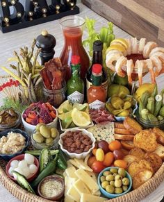 a basket filled with different types of food and condiments on top of a table