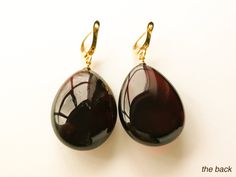 "Natural Baltic amber dark cherry/ burgundy color earrings is a perfect choice for classy style admirers! Perfect choice to brighten up office outfit or look even more beautiful on a special occasion! Shaped in drop form these earrings look delicate yet fancy. MATERIALS AND SIZE: Stone: 100% Natural Baltic Amber Findings: sterling silver 925 gold plated Weight: 8,3 g (0,29 oz) Bead size: 3 cm (1,18 in) x 2 cm (0,78 in) Total length: 4,7 cm (1,85 in) PLEASE NOTE: All our amber production is made Elegant Burgundy Earrings For Formal Occasions, Elegant Amber Earrings For Formal Occasions, Elegant Brown Drop Earrings, Elegant Tortoiseshell Drop Earrings, Classy Women Style, Cherry Color, Color Earrings, Amber Earrings, Office Outfit