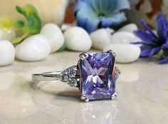 Don't miss this opportunity to own this beautiful gemstone ring crafted in 14k gold filled => Gemstone Type - Lab Grown Amethyst, Clear Quartz => Gemstone Cut - Faceted => Gemstone Size - 8*10 mm, 2 mm => Total Number of Gemstones - 7 => Metal Type - 14k Gold Filled (Tarnish Resistant And Nickel Free) - also available in 925 sterling silver * Please contact me for pricing on a sizes larger than 11 * ~ Feel free to ask me about custom made designs. ❏ Replacements and custom orders Rectangular Amethyst Ring With Accent Stones, Purple Rectangular Stone Ring For Anniversary, Purple Rings With Rectangular Stone For Anniversary, Rectangular Purple Rings With Accent Stones, Rectangular Amethyst Wedding Rings, Purple Rectangular Gemstone Ring, Rectangular Amethyst Ring For Anniversary, Rectangular Promise Ring With Accent Stones, Rectangular Promise Ring With Center Stone