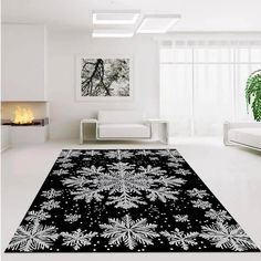 a black and white rug with snowflakes on it in front of a fireplace