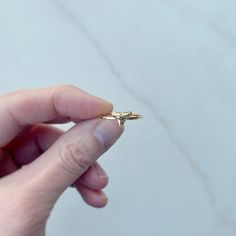 This ring is just the right balance of fierce and delicate. It features the most perfect little shark tooth that I found at Caspersen Beach in Venice, FL. This tiny tooth has been lovingly cast in sterling silver and soldered onto a dainty, handmade hammered sterling silver ring. The ring is then plated in 14k gold. Gold vermeil adds a thick layer of gold over sterling silver, which allows for the glam of gold without the hefty price tag! Gold vermeil is practical and long-wearing.   This ring i Shark Tooth Ring, Shark Ring, Tooth Ring, Gold Stacking Ring, Hammered Ring, Jewelry Summer, Hammered Rings, Ring Stack, Shark Tooth