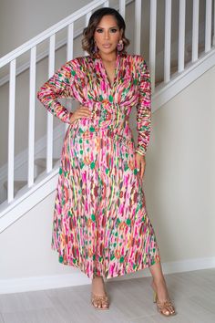 The Malia dress features a deep V-neck and a shawl collar, with a regular fit and high waistline. Its multicolor all-over print and long sleeves give it a touch of sophistication, while the slight stretch fabric offers comfort and a flattering silhouette. Perfect for both casual and elegant occasions, this A-line dress exudes an air of luxury and taste. 95% Polyester, 5% Elastane Model is wearing size small Please allow 3-5 business days to process and ship. Product Measurements in cm : Size US Bust Waist Size Length Sleeve Length Cuff S 4 96 62-96 132 68.5 20 M 6 100 66-100 134 69.7 21 L 8/10 106 72-106 136 70.9 22.5 XL 12 112 78-112 138 72.1 24 XXL 14 118 84-118 140 73.3 25.5 Vibrant Print V-neck Midi Dress For Party, Multicolor Surplice Neckline Midi Dress, Multicolor Surplice Neckline Midi Dress For Spring, Spring Multicolor Midi Dress With Surplice Neckline, Chic Multicolor V-neck Midi Dress, V-neck Midi Dress With Vibrant Print For Party, Multicolor Abstract Print V-neck Maxi Dress, Chic Multicolor Wrap Dress With Surplice Neckline, Multicolor Printed V-neck Midi Dress