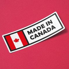 a canadian made in canada sticker on a pink background