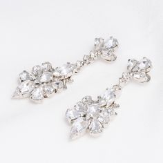 Add sparkle with our SILA Swarovski drop earring! Inspired by tear drop shaped crystals in different sizes to add a lasting touch to every look. These will look fashionable with a casual look or a night out paired with your favorite dress and heels. Handcrafted with the Highest Quality Materials Swarovski Crystals Platinum plated - Guards against scratches and tarnish. Approx. Length 2 " Approx. Width 1" Hypoallergenic & Nickel free Earring Inspired, Swarovski Drop Earrings, Crystals Earrings, Shaped Crystals, Boutique Couture, Swarovski Crystal Earrings, Earrings Wedding, Drop Earring, Wedding Jewelry Sets