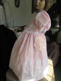 This is a high quality childs dress, it is white embroidered organza over peach fabric,  buttons with pearl buttons in back  not used. in good condition.  size 3-4 have another one in a larger size   # 7235.  no refunds waist is approx 18 inches, length of dress shoulder to hem 32 inches Pink First Communion Ball Gown Dress, Pink Ball Gown For First Communion, Pink First Communion Ball Gown, Fitted Princess Dress For Summer Wedding, Summer Wedding Fitted Princess Dress, Fitted Summer Princess Dress For Formal Occasions, Fitted Princess Dress For Summer Formals, Fitted Princess Dress For Formal Summer Events, Summer Formal Fitted Princess Dress