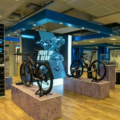 there are two bikes on display in the store